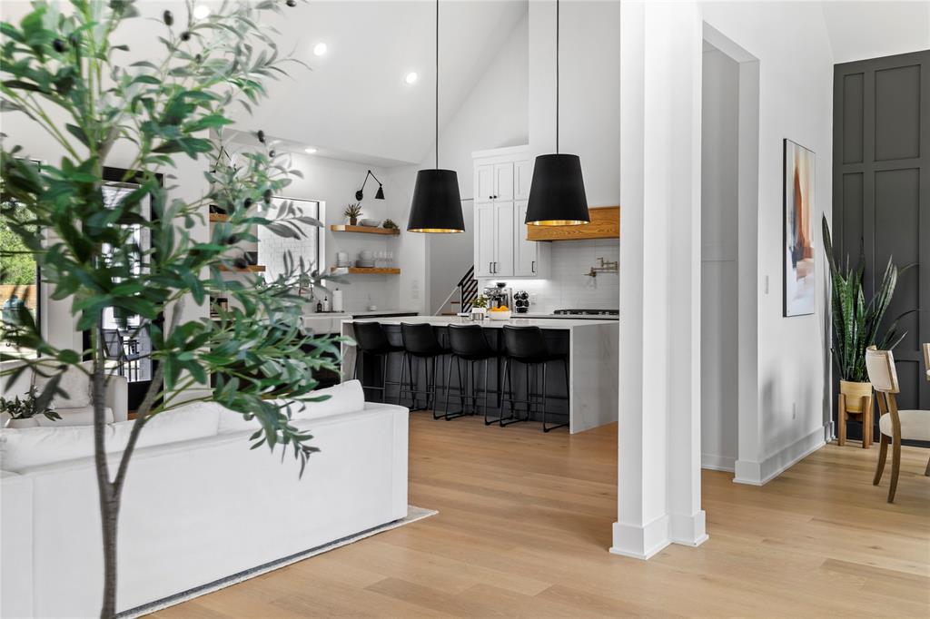 21197 Gatlinburg Road Bullard, TX 75757 - Photo 17 of 40 a living room with furniture wooden floor and a potted plant