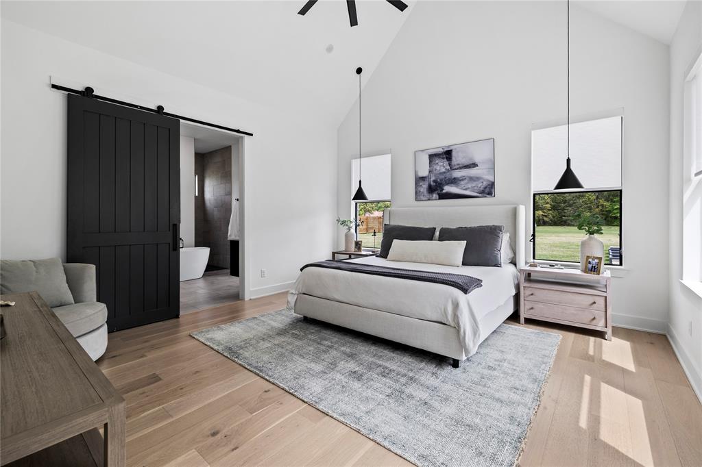 21197 Gatlinburg Road Bullard, TX 75757 - Photo 18 of 40 a bedroom with a large bed and a couch