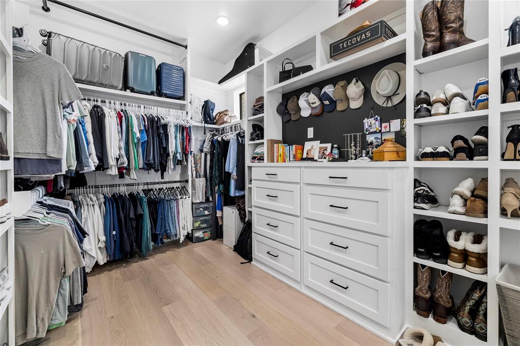 21197 Gatlinburg Road Bullard, TX 75757 - Photo 22 of 40 a view of walk in closet with clothes and shoes