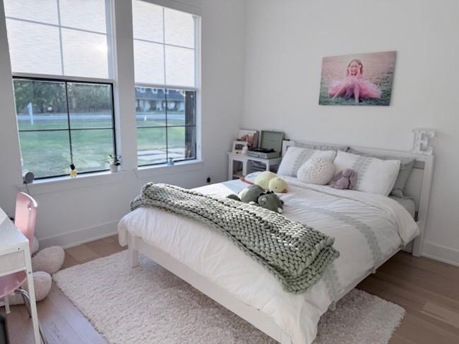 21197 Gatlinburg Road Bullard, TX 75757 - Photo 24 of 40 a bedroom with a bed and a painting on the wall