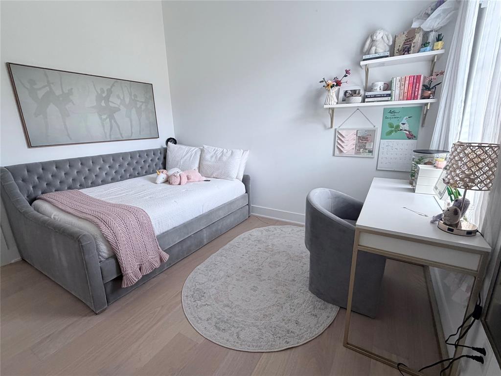 21197 Gatlinburg Road Bullard, TX 75757 - Photo 28 of 40 a bedroom with a bed and a chair