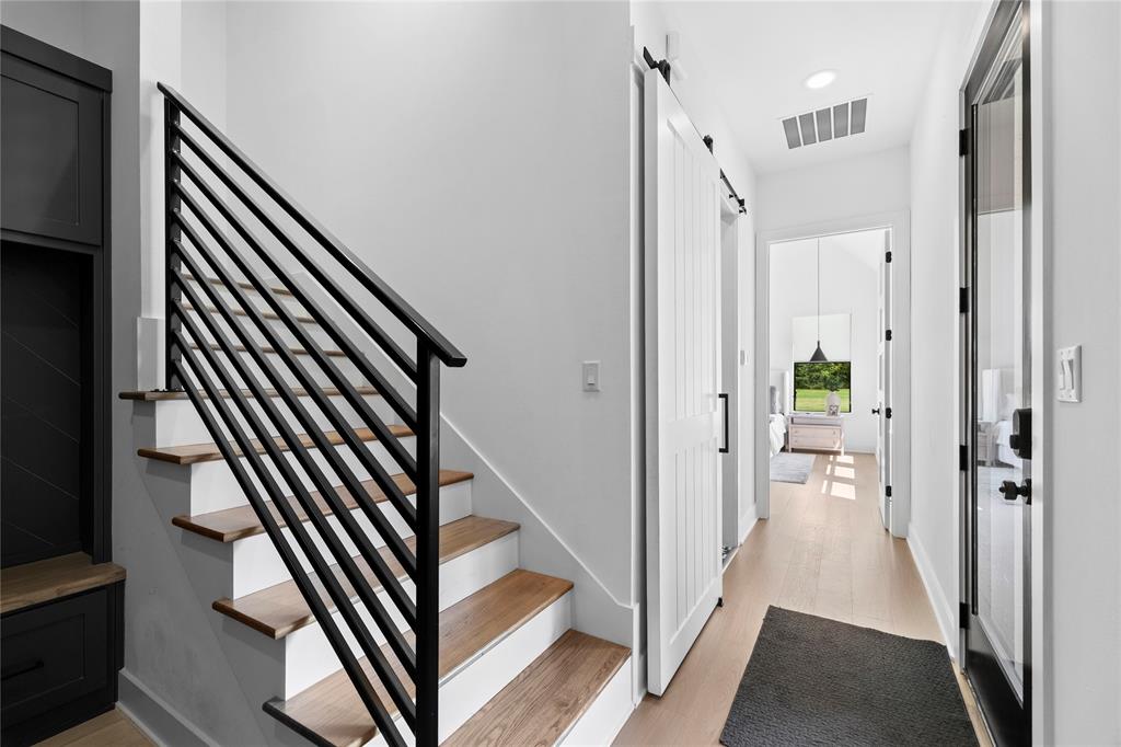 21197 Gatlinburg Road Bullard, TX 75757 - Photo 31 of 40 a view of a hallway with wooden floor and staircase