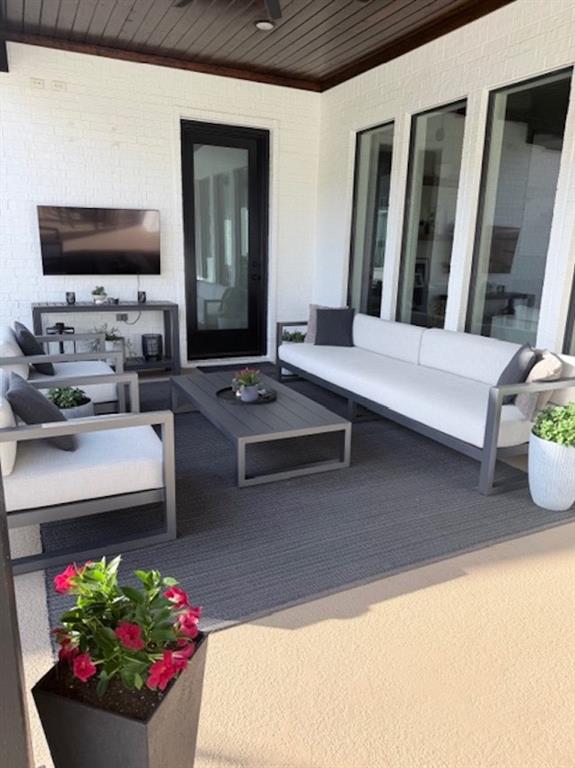 21197 Gatlinburg Road Bullard, TX 75757 - Photo 33 of 40 a living room with furniture and a flat screen tv