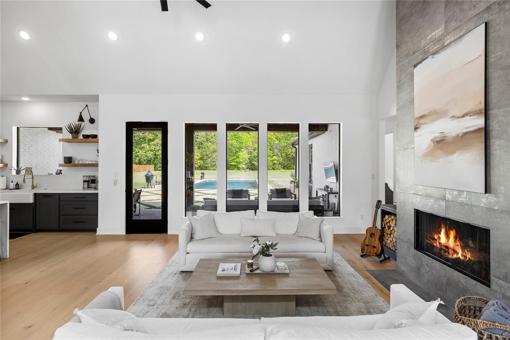 21197 Gatlinburg Road Bullard, TX 75757 - Photo 8 of 40 a living room with furniture and a fireplace
