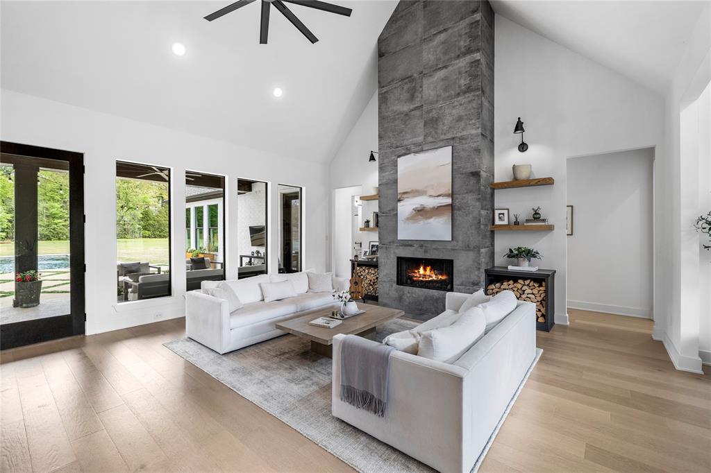 21197 Gatlinburg Road Bullard, TX 75757 - Photo 9 of 40 a living room with furniture and a fireplace