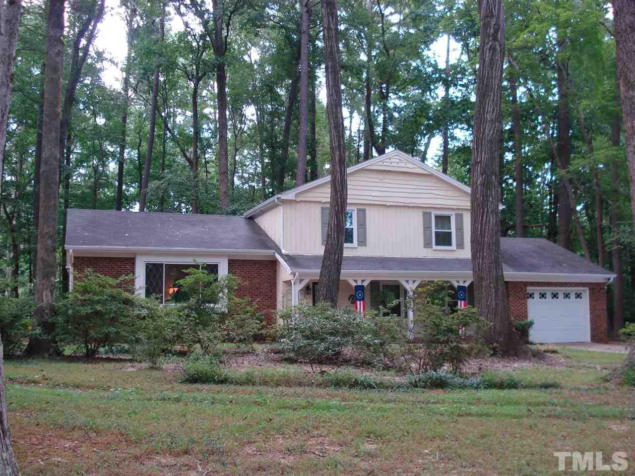 8712 Hidden View Court Raleigh, NC 27613 - Photo 2 of 17 a view of a house with a yard and a large tree