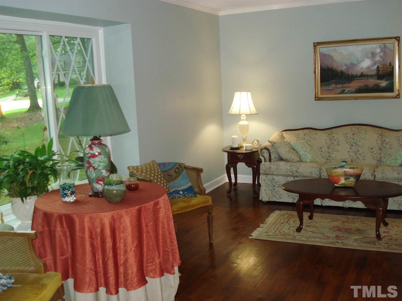 8712 Hidden View Court Raleigh, NC 27613 - Photo 3 of 17 a living room with furniture and a lamp