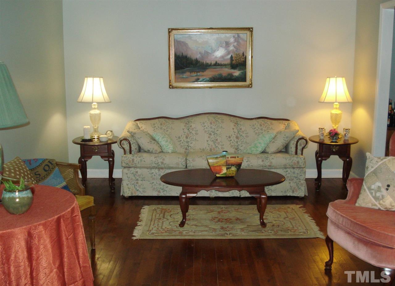 8712 Hidden View Court Raleigh, NC 27613 - Photo 4 of 17 a living room with furniture and a lamp