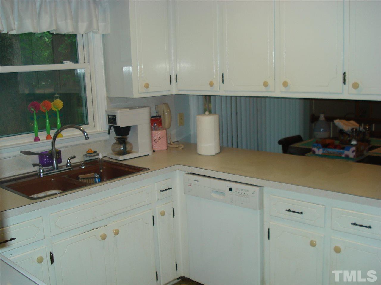 8712 Hidden View Court Raleigh, NC 27613 - Photo 6 of 17 a kitchen with a sink and cabinets