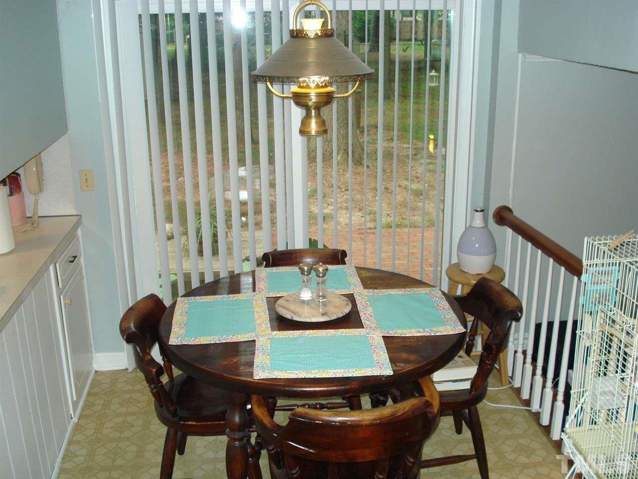 8712 Hidden View Court Raleigh, NC 27613 - Photo 8 of 17 a view of a dining room with furniture and window