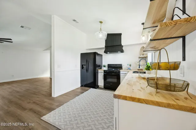 a bedroom with a bed and a ceiling fan
