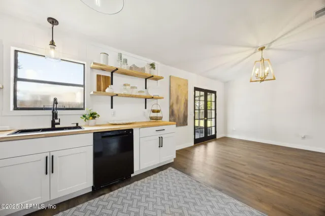 a spacious bedroom with a bed and a window