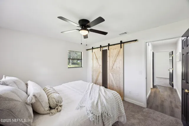 a view of a backyard with small cabin