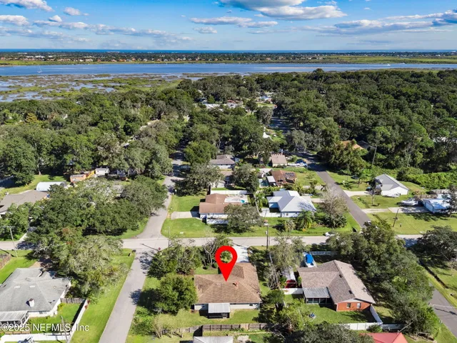 a view of a porch with furniture and garden