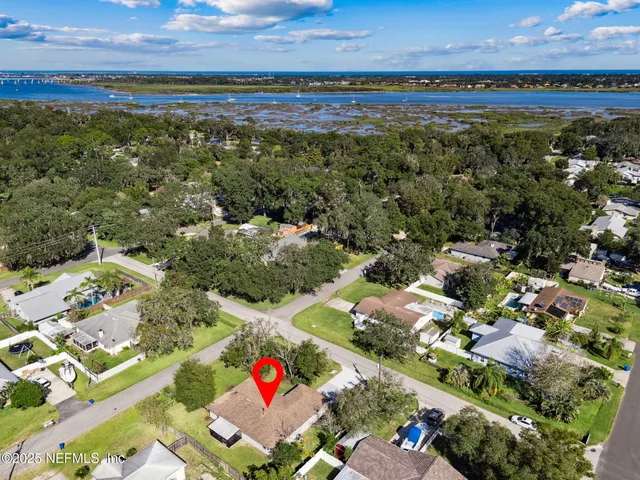a front view of a building with potted plants