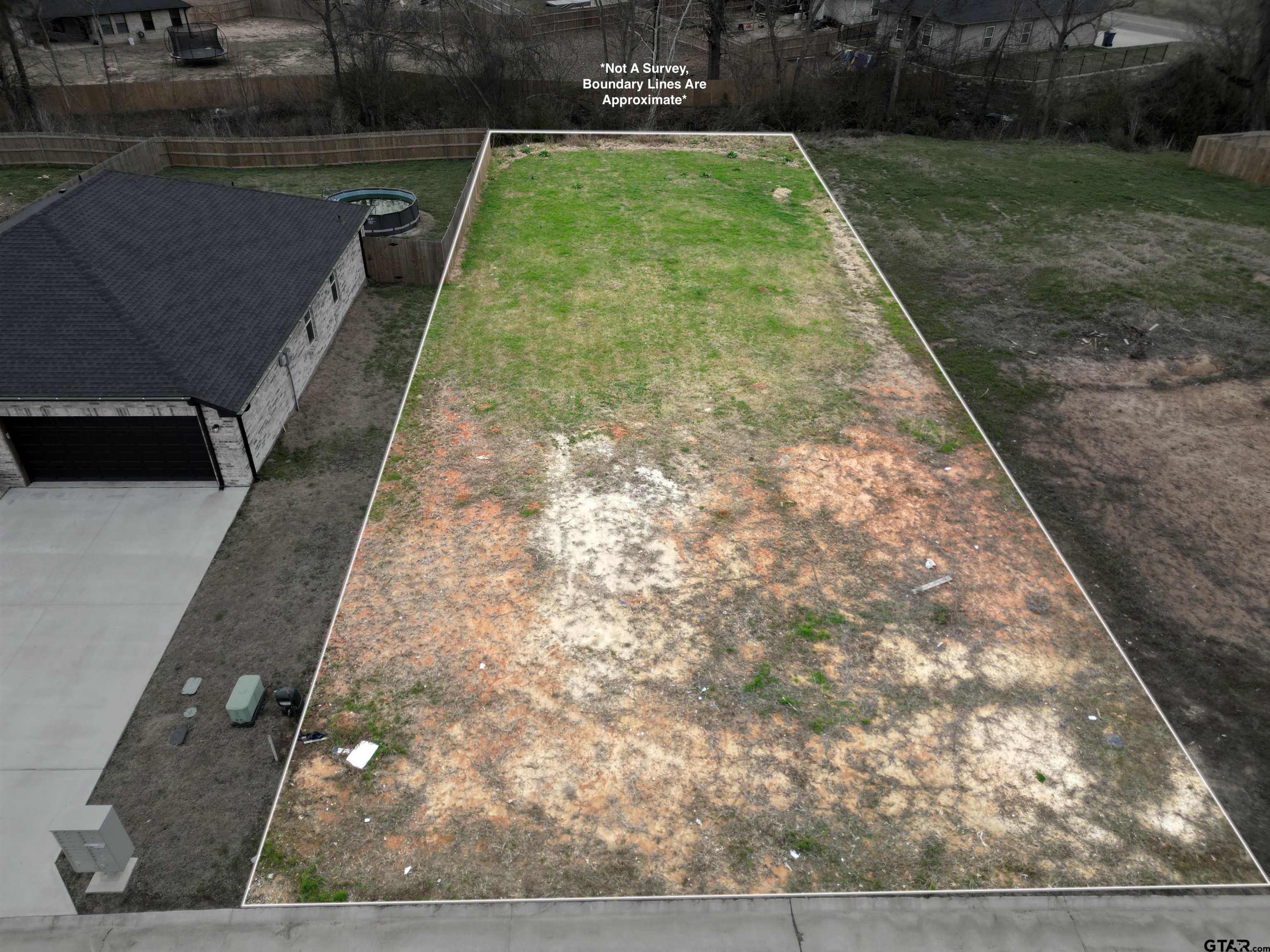 104 Arledge Street Mount Pleasant, TX 75455 - Photo 2 of 4 a view of a backyard