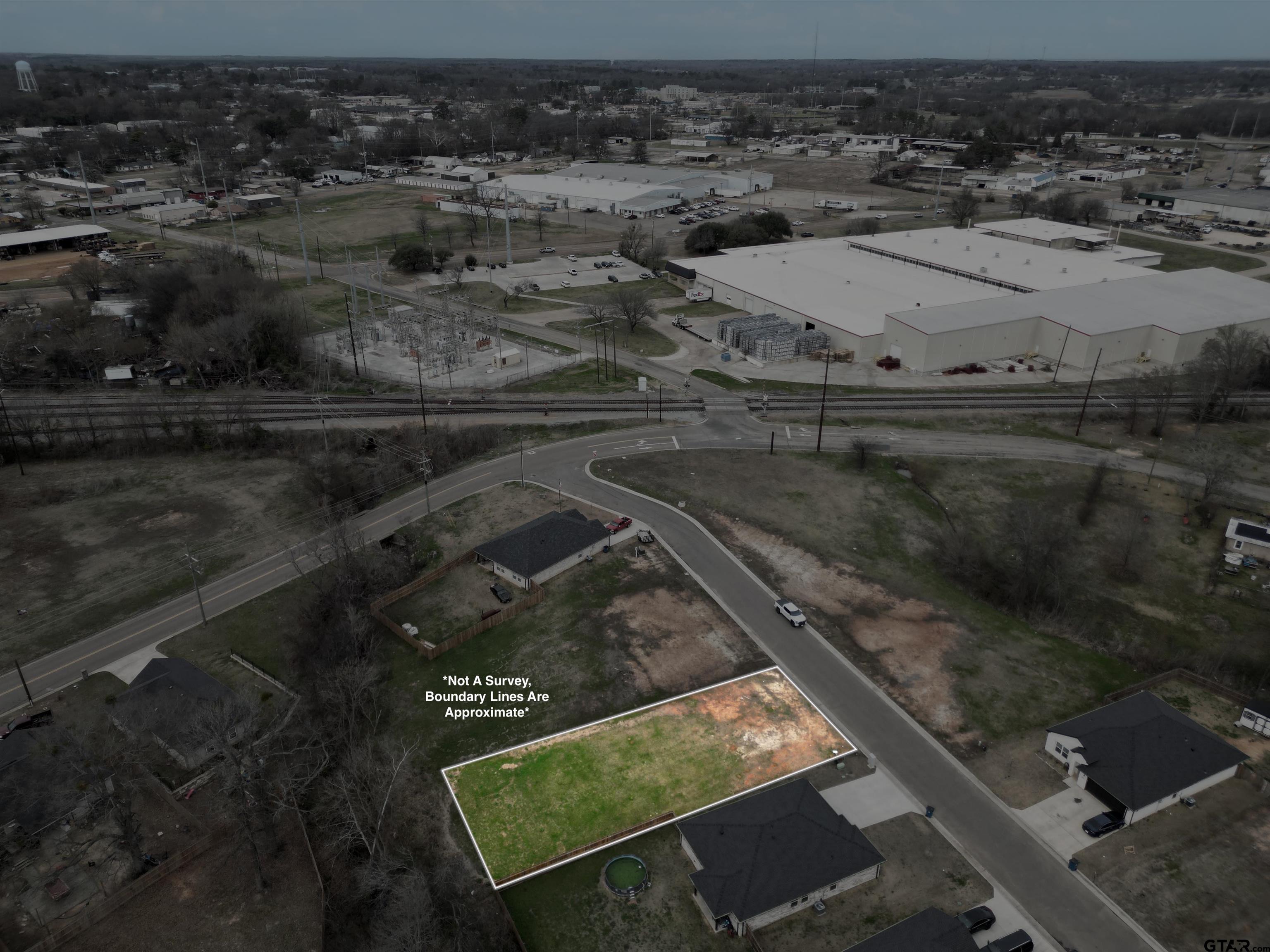 104 Arledge Street Mount Pleasant, TX 75455 - Photo 4 of 4 an aerial view of residential houses with outdoor space