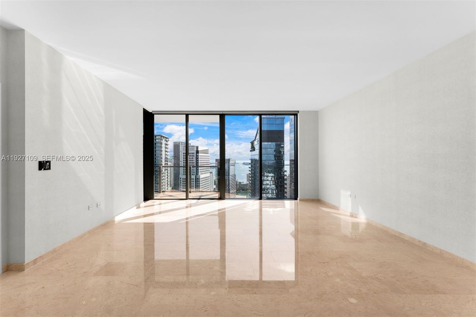 88 Southwest 7th Street, Unit 3907 Miami, FL 33130 - Photo 14 of 33 a view of an empty room with a window