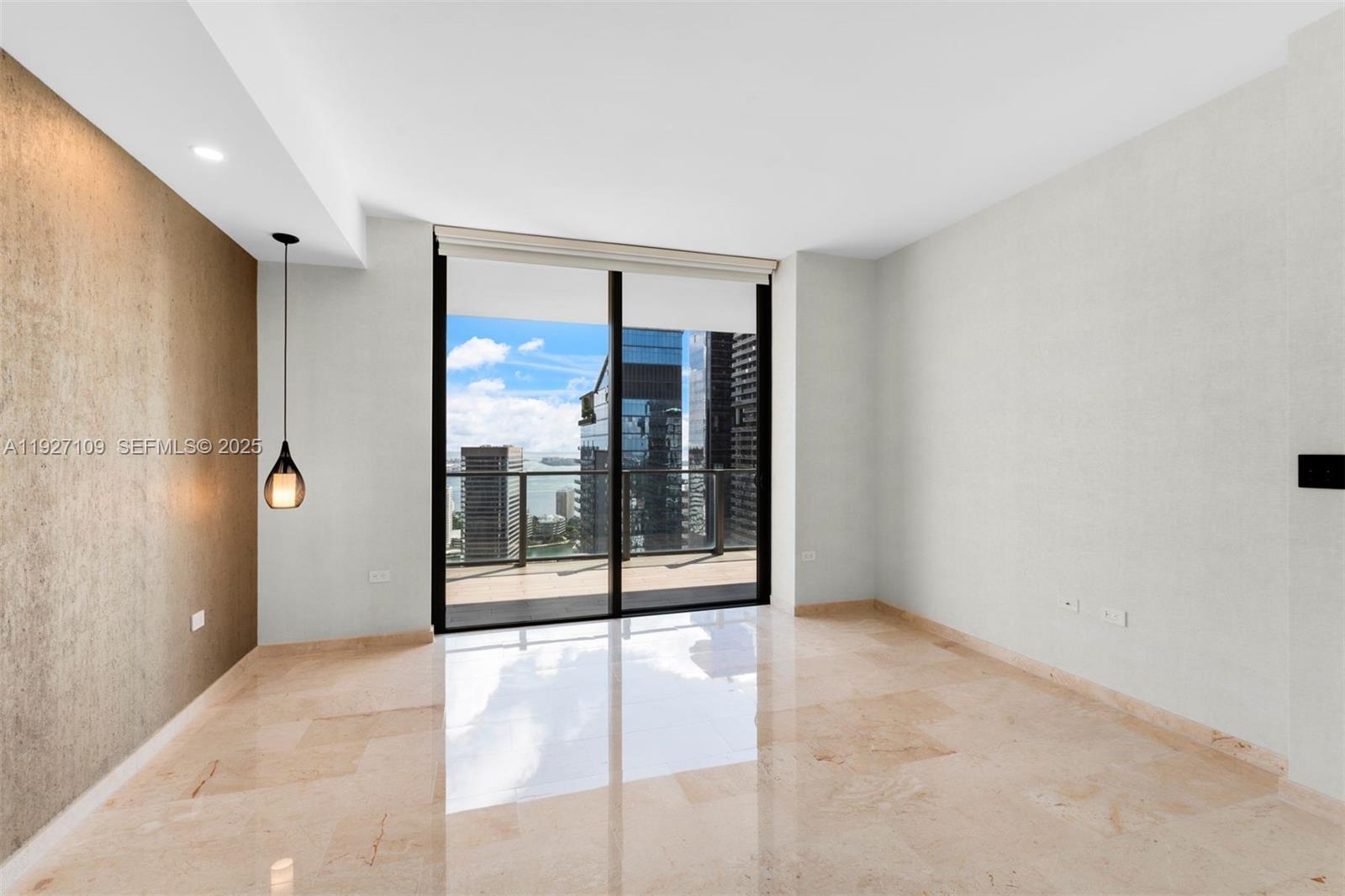 88 Southwest 7th Street, Unit 3907 Miami, FL 33130 - Photo 20 of 33 a view of an empty room with a window