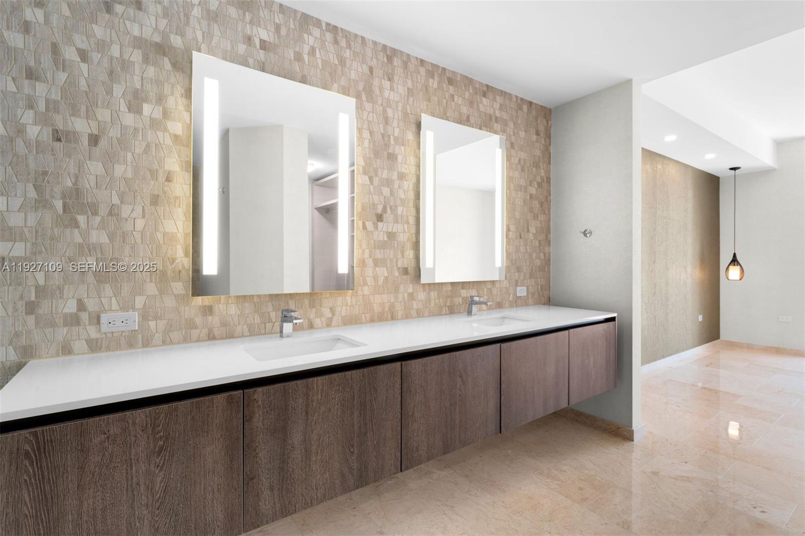 88 Southwest 7th Street, Unit 3907 Miami, FL 33130 - Photo 23 of 33 a bathroom with a double vanity sink and a mirror