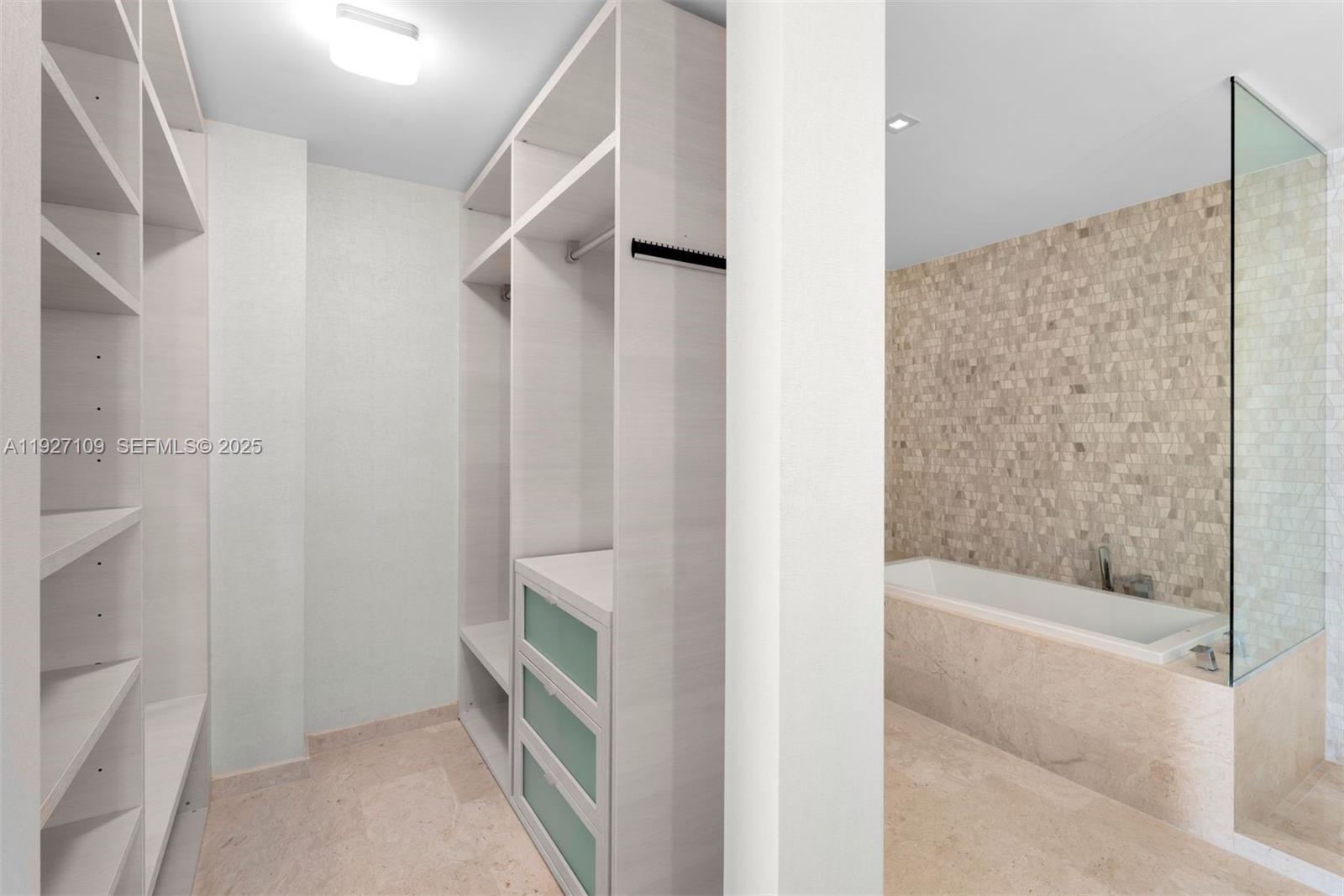 88 Southwest 7th Street, Unit 3907 Miami, FL 33130 - Photo 25 of 33 a bathroom with a bathtub and a shower