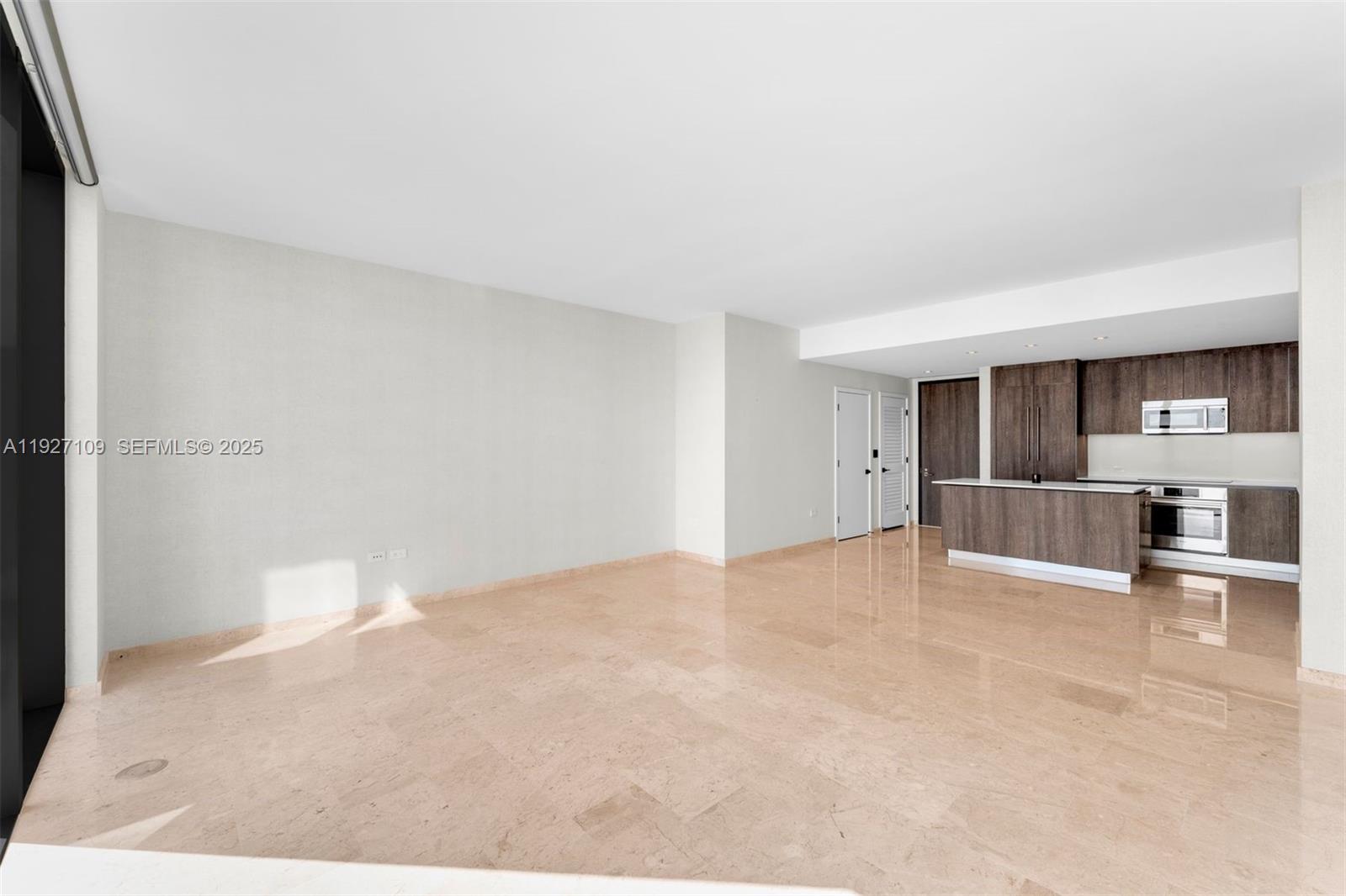 88 Southwest 7th Street, Unit 3907 Miami, FL 33130 - Photo 8 of 33 a view of a kitchen with a sink and cabinets