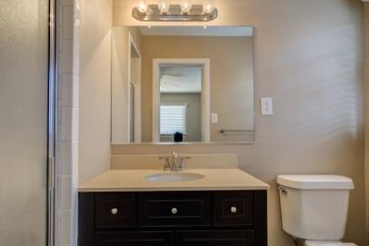 2611 49th Street Lubbock, TX 79413 - Photo 24 of 35 a bathroom with a sink and a toilet