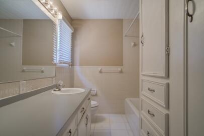2611 49th Street Lubbock, TX 79413 - Photo 29 of 35 a bathroom with a sink a toilet and shower