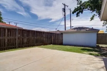 a view of a backyard of the house