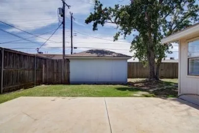 a view of a backyard of the house