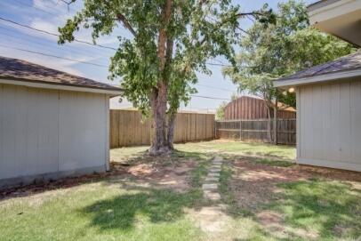 2611 49th Street Lubbock, TX 79413 - Photo 35 of 35 a view of a backyard with a tree
