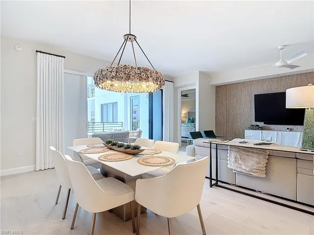 a dining room with a table and chairs