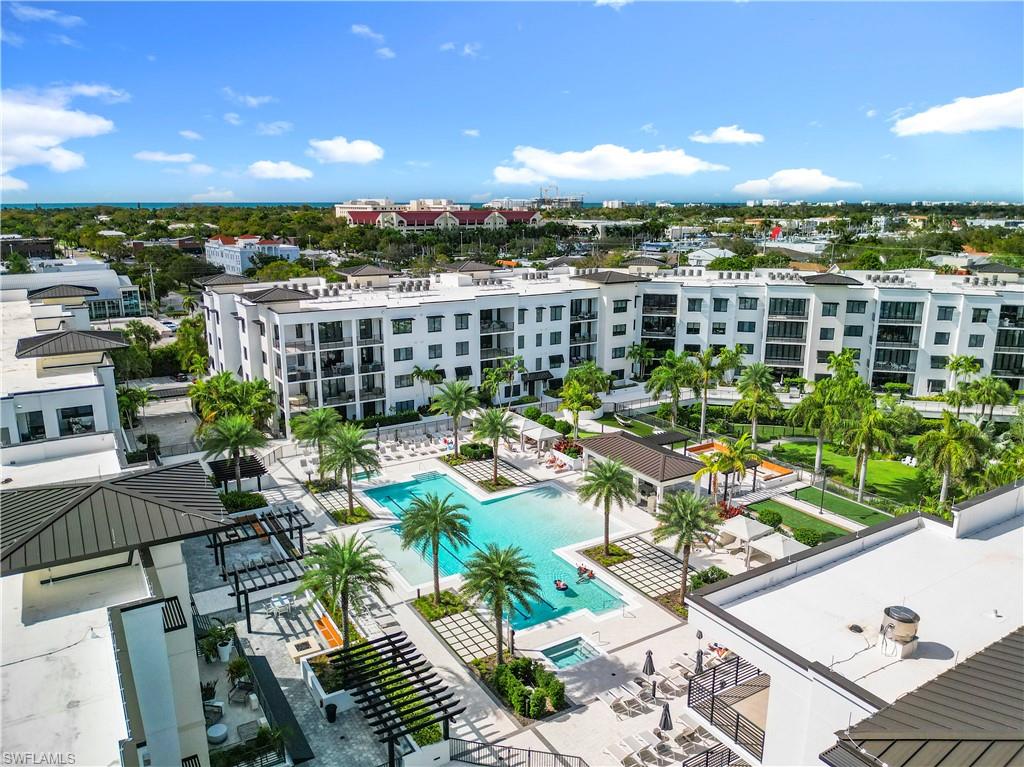 1125 Central Avenue, Unit 462 Naples, FL 34102 - Photo 32 of 48 a view of a balcony with chairs