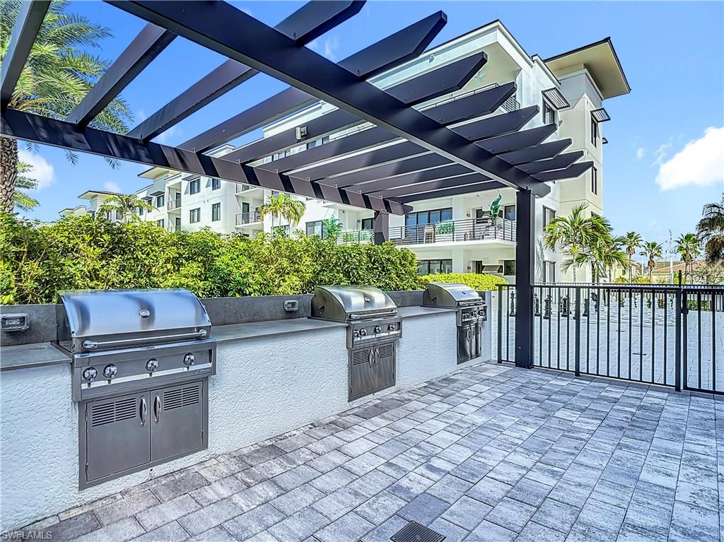 1125 Central Avenue, Unit 462 Naples, FL 34102 - Photo 38 of 48 a outdoor space with chairs