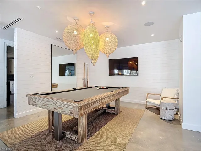a kitchen with a table chairs and a dining table