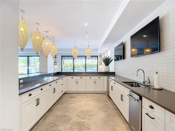 a kitchen with stainless steel appliances a refrigerator and a sink