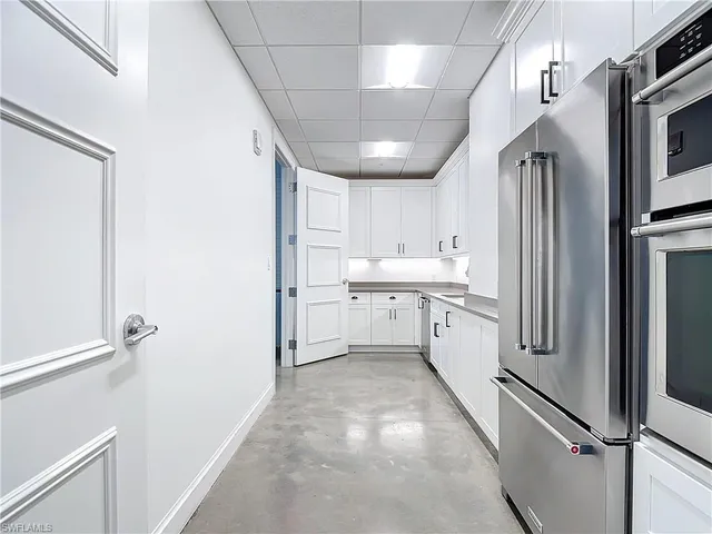 a kitchen with appliances and cabinets