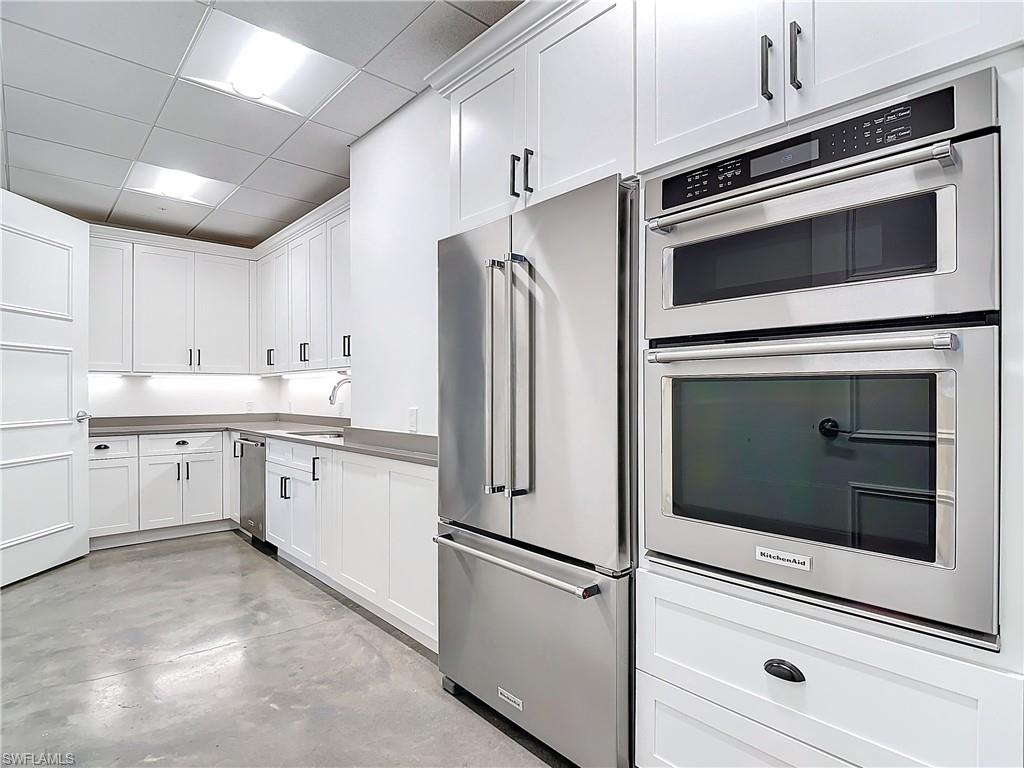 1125 Central Avenue, Unit 462 Naples, FL 34102 - Photo 46 of 48 a kitchen with appliances and cabinets