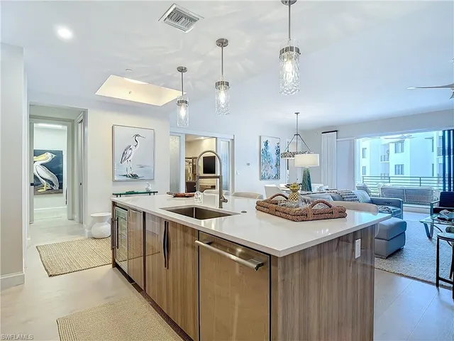 a kitchen that has a lot of cabinets in it