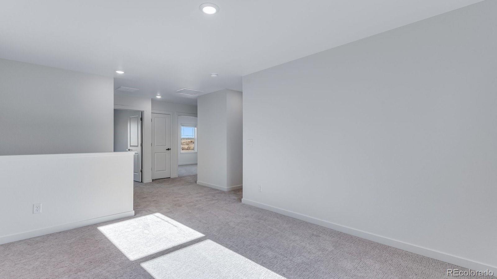 3434 Belleville Ridge Road Elizabeth, CO 80107 - Photo 33 of 48 a view of a big room with windows and closet