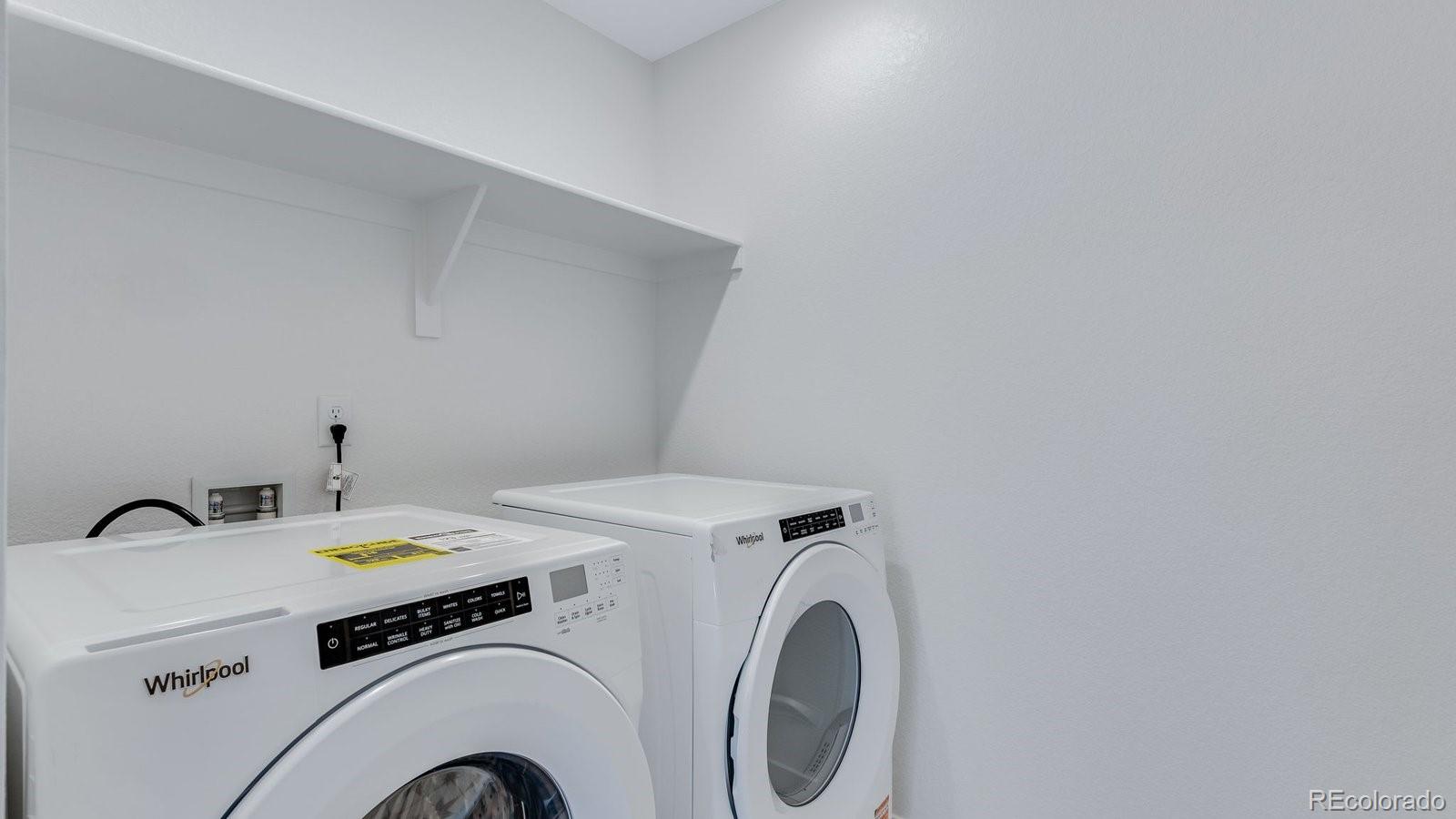 3434 Belleville Ridge Road Elizabeth, CO 80107 - Photo 37 of 48 a utility room with dryer and washer