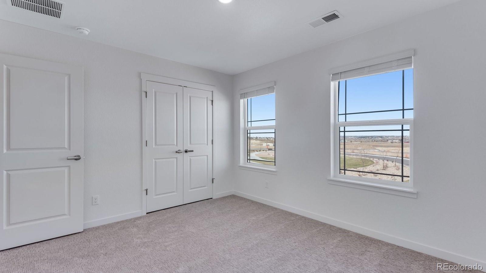 3434 Belleville Ridge Road Elizabeth, CO 80107 - Photo 39 of 48 a view of an empty room with windows