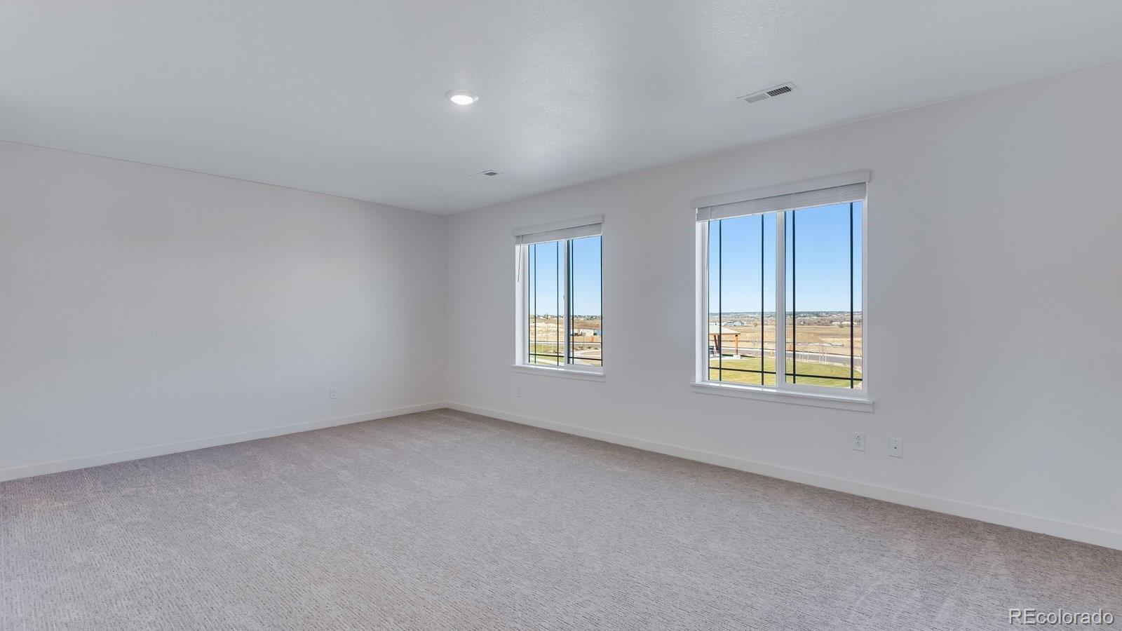 3434 Belleville Ridge Road Elizabeth, CO 80107 - Photo 40 of 48 an empty room with windows