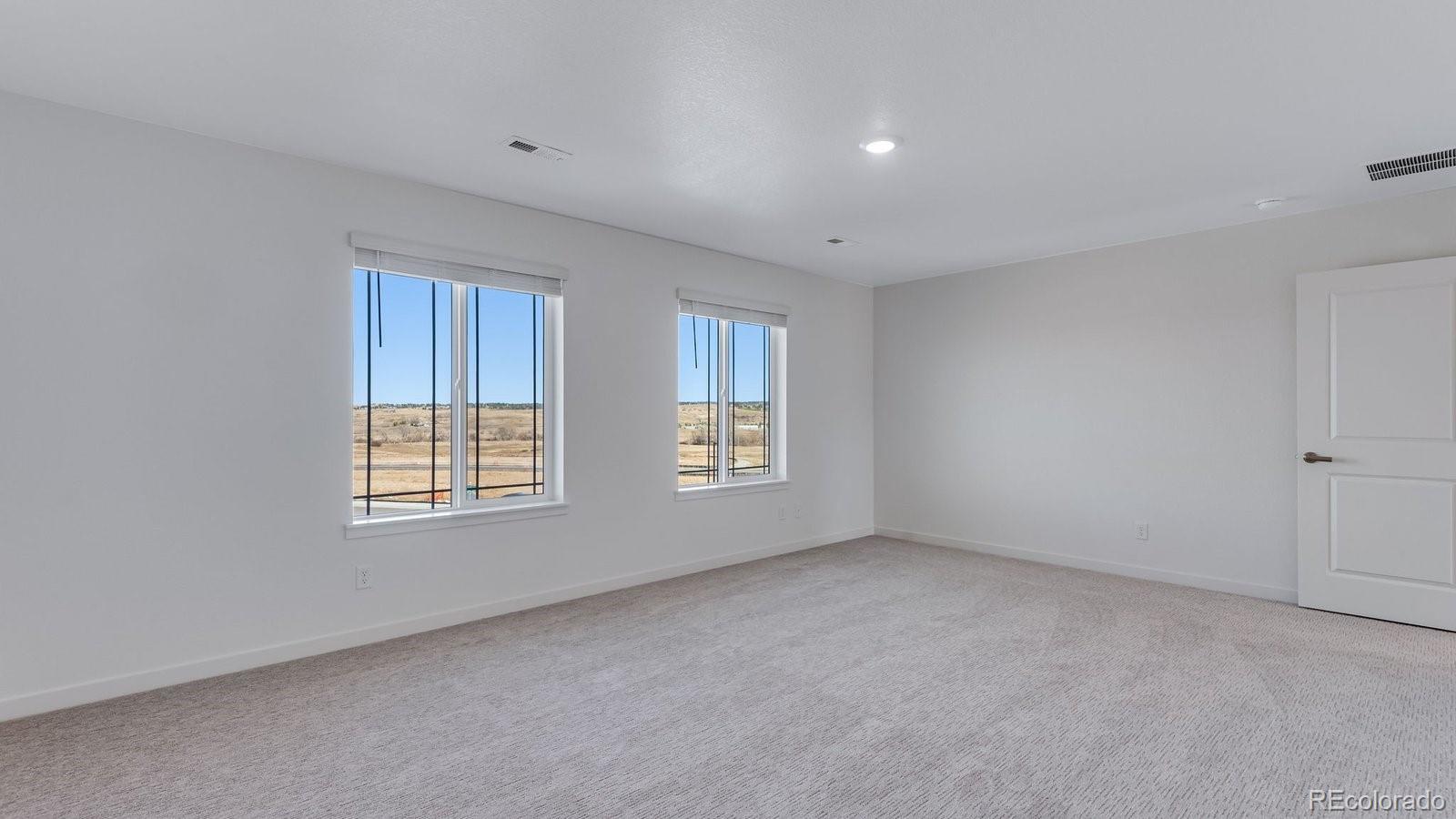 3434 Belleville Ridge Road Elizabeth, CO 80107 - Photo 41 of 48 an empty room with windows