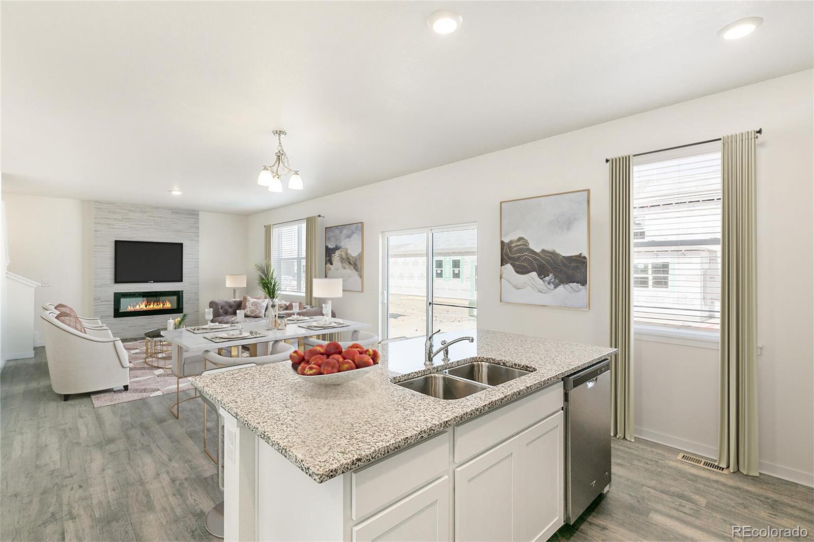 3434 Belleville Ridge Road Elizabeth, CO 80107 - Photo 5 of 48 a kitchen with stainless steel appliances granite countertop a sink dishwasher a stove and a refrigerator with wooden floor