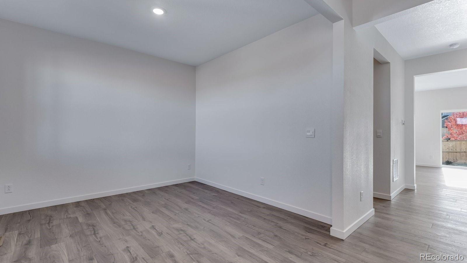 3434 Belleville Ridge Road Elizabeth, CO 80107 - Photo 10 of 48 a view of a room with wooden floor