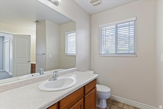 2350 South Highway 89, Unit 4 Perry, UT 84302 - Photo 27 of 30 Half bath with vanity and toilet