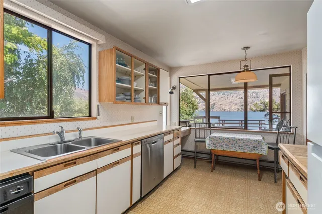 a bathroom with a sink and a large window
