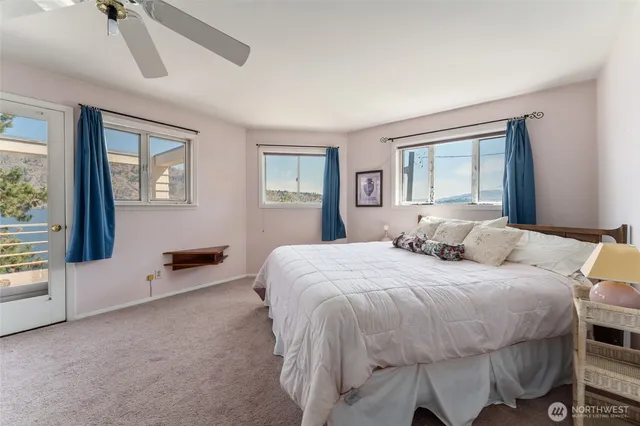 a bed room with a bed and a window