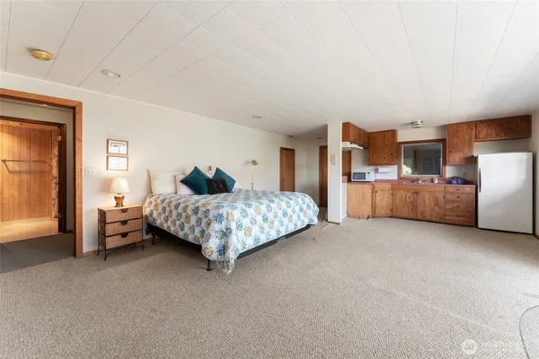 a bedroom with bed and window